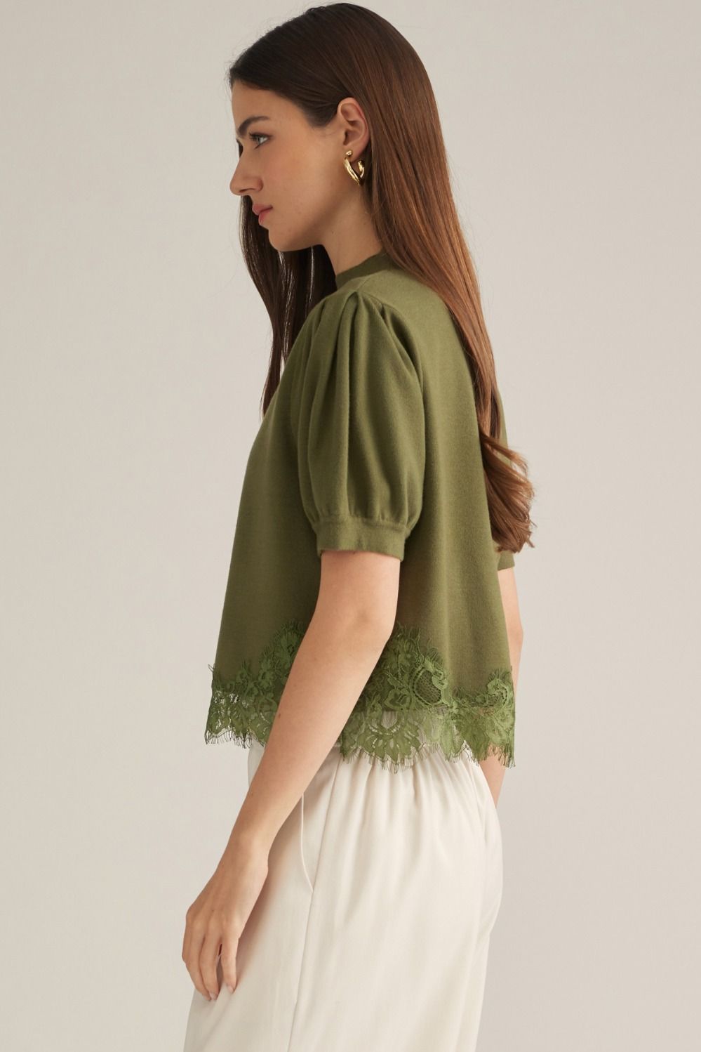 Green puff sleeve sweater with lace bottom detail
