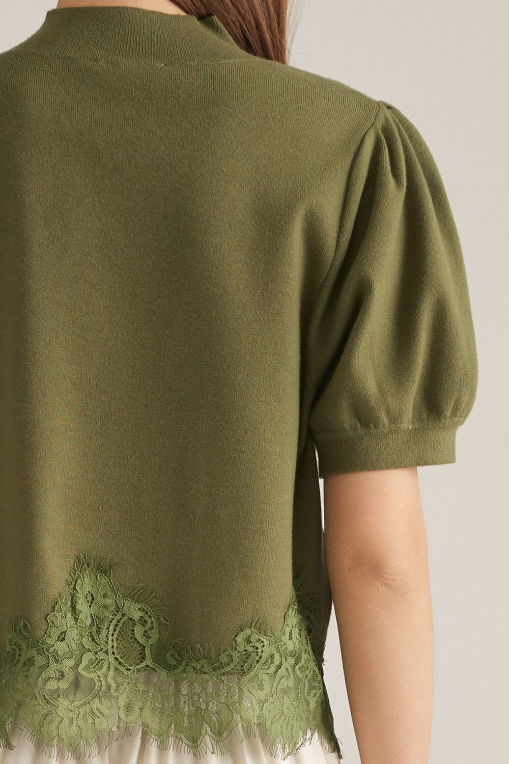 Green puff sleeve sweater with lace bottom detail